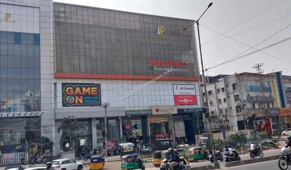 Exterior view of the commercial complex with JP Cinemas and Game On located near Prestige Golden Grove in Hyderabad