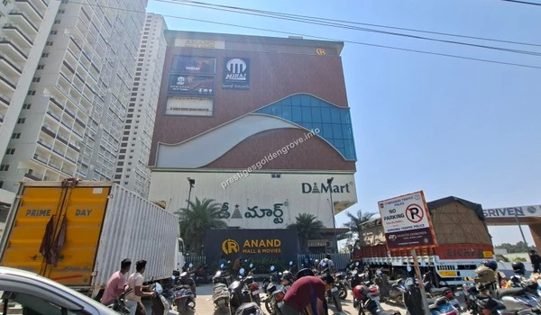 Exterior view of Anand Mall featuring DMart supermarket and Miraj cinemas, offering excellent retail and entertainment options for Prestige Golden Grove residents