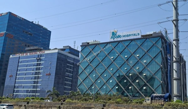 The striking modern glass facade of Apollo Hospitals, representing the premium multi-specialty healthcare infrastructure available near the Prestige Golden Grove community