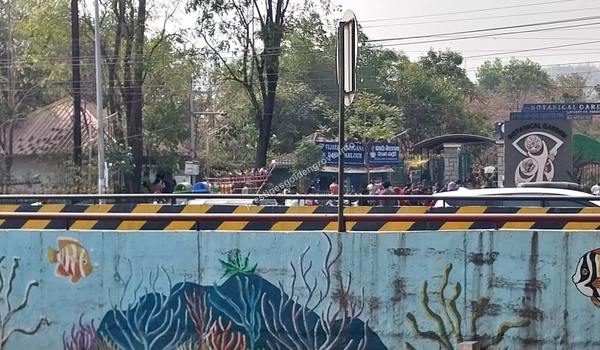 View of the Botanical Garden near Prestige Golden Grove in Bangalore, featuring a colorful fish mural on the underpass wall