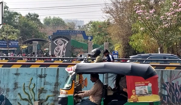 View of the entrance to the Botanical Garden near Prestige Golden Grove in Bangalore, showcasing the lush greenery and convenient local connectivity