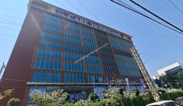 Wide street perspective of the expansive Care Hospitals building, highlighting the top-tier medical infrastructure available near Prestige Golden Grove