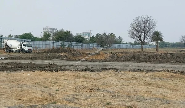 A heavy-duty cement mixer truck parked on site amidst the ongoing preliminary groundwork at Prestige Golden Grove