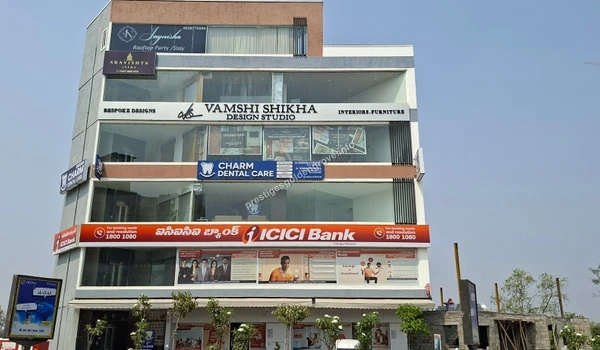 View of a commercial building featuring Charm Dental Care and essential banking facilities, located conveniently close to the Prestige Golden Grove residential project