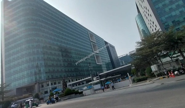 View of the Deloitte Corporate Park in Gachibowli with street traffic near Prestige Golden Grove