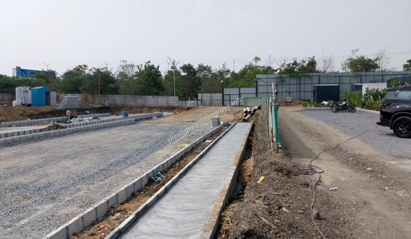 Detailed view of concrete curbing and drainage channel construction along the internal pathways of Prestige Golden Grove