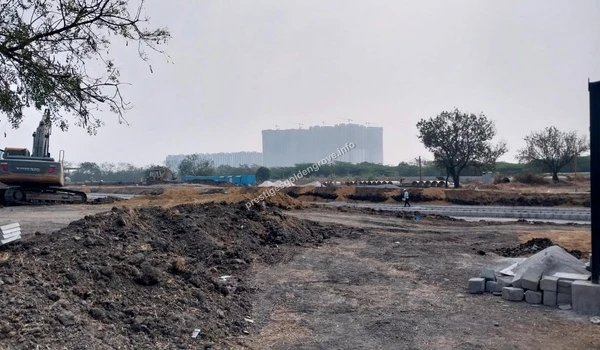 Heavy excavator machinery moving dirt and preparing the terrain at the Prestige Golden Grove development site