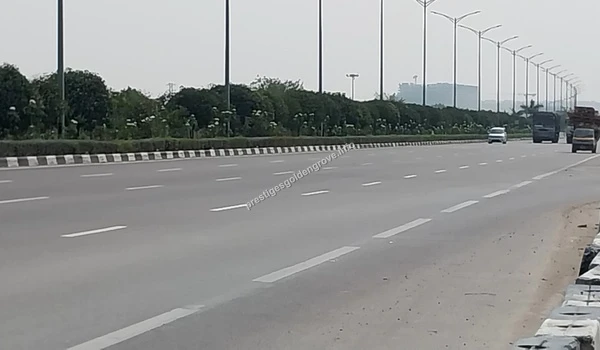 Wide view of the high-speed expressway lanes near Kollur, showcasing the modern infrastructure and fast commute options from Prestige Golden Grove