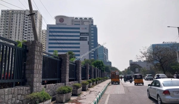 View of the modern glass facade IT park in the Financial District highlighting the major employment hubs near Prestige Golden Grove