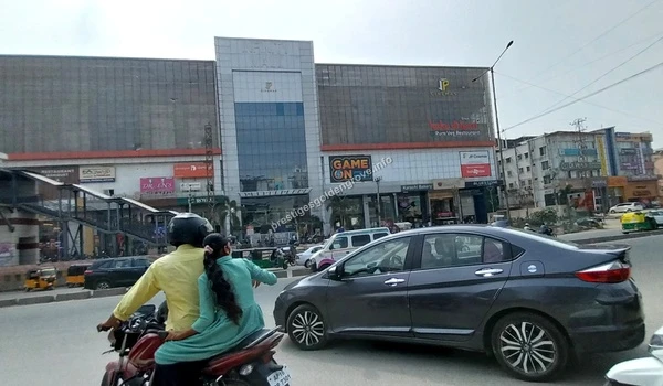 The impressive glass facade of GSM Mall in Chandanagar featuring major retail brands and a multiplex near Prestige Golden Grove in Hyderabad