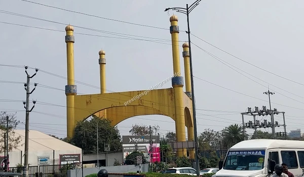The iconic yellow archway near the Hitex Exhibition Center symbolizing the prime connectivity of Hitech City to Prestige Golden Grove