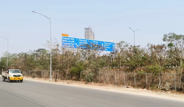 Clear overhead blue guide signs documented on March 03 , 2026, directing commuters towards Kokapet SEZ and Neopolis along the Nehru Outer Ring Road, conveniently close to Prestige Golden Grove.