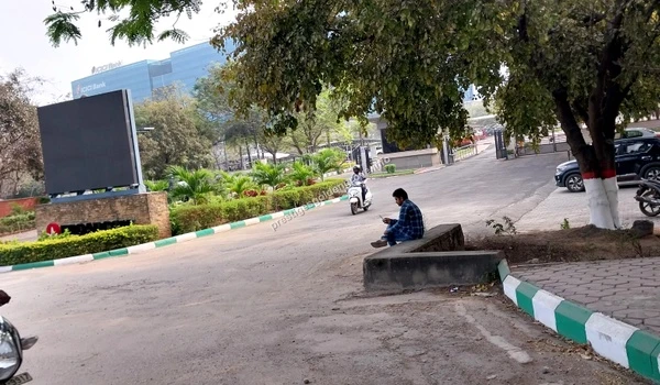 Serene view of the ICICI Bank campus framed by greenery and trees showcasing the pleasant surroundings near Prestige Golden Grove