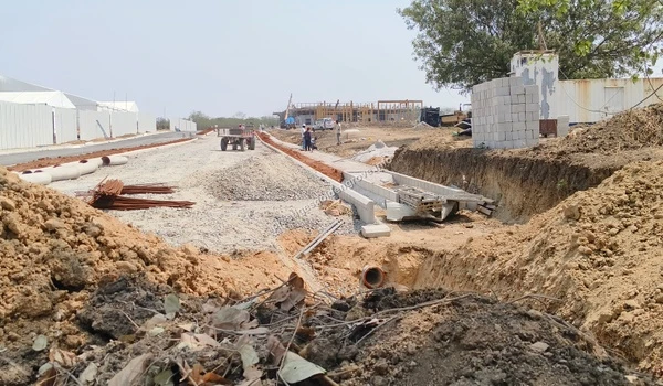 Ongoing civil work captured on March 03 , 2026, showing the laying of underground pipes and internal road base preparation at the Prestige Golden Grove site situated along the Nehru Outer Ring Road.