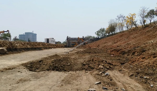 Earthmoving equipment actively grading the land on March 03 , 2026, as part of the foundational phase for the Prestige Golden Grove master plan, strategically positioned off the Nehru Outer Ring Road.