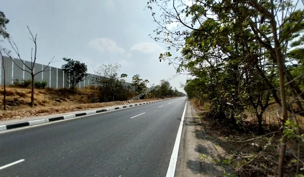 Scenic view of the well-maintained Patancheruvu road stretch, highlighting the lush green surroundings and peaceful approach to Prestige Golden Grove