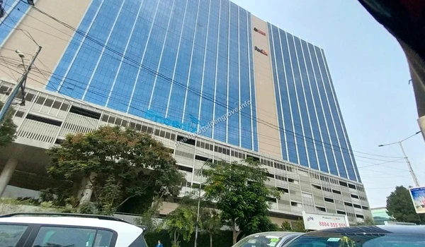 Street view of the modern blue glass facade of the Phoenix commercial building near Prestige Golden Grove