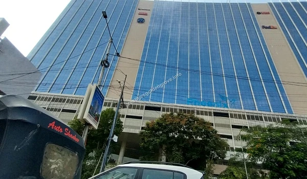 Commuter view of the Phoenix Commercial District building from an auto rickshaw near Prestige Golden Grove