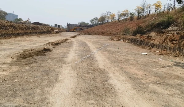 View of the extensive earthwork and site preparation at the Prestige Golden Grove property on March 03 , 2026, showcasing heavy machinery excavating the terrain near the Nehru Outer Ring Road.