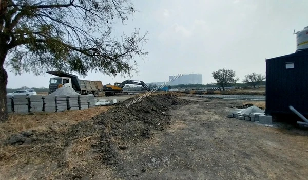 Expansive view of the land development and high-rise construction progress at Prestige Golden Grove in Hyderabad