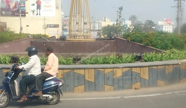 Lush green landscaping and modern street structures at the Tellapur Junction highlighting the scenic and well-maintained approach to Prestige Golden Grove